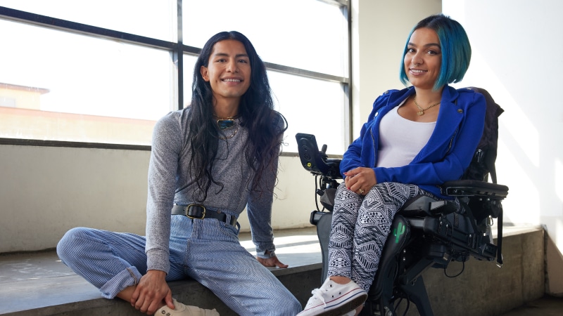 Two people sitting side by side